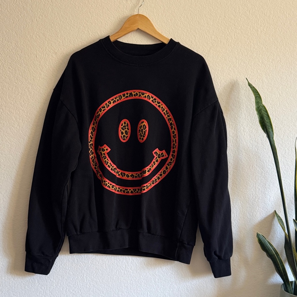 Dressed in LALA Black Hoodie with Red Leopard Smiley